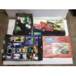 Various toys including toy cars, two minic tri-ang motor racing sets and other minic items