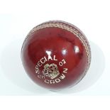 An autographed cricket ball signed by Dickie Bird.