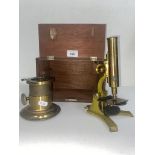 An antique brass microscope & magic lantern lens