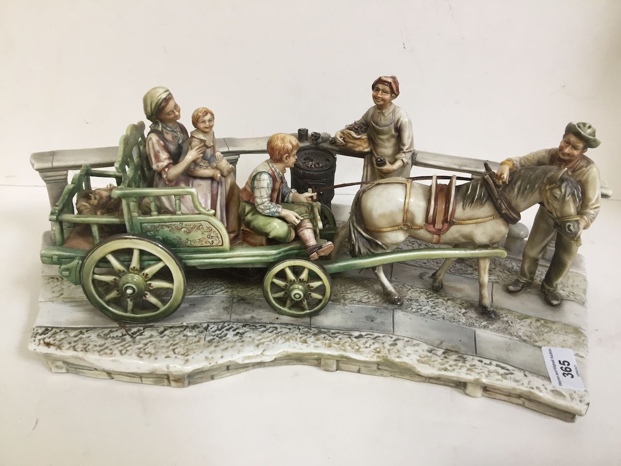 A large Capo Di-Monte, figures plus wagon and horse