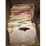 Box containing 1970s singles, The Hollies, The Stylistics, The Shadows etc.