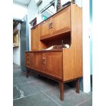 A 1970s G Plan teak highboard, length 160cm, depth 46cm and height 145cm