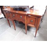 An Edwardian mahogany breakfront sideboard, length 135.5cm, depth 56cm and height 90cm