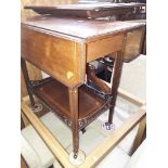 An inlaid mahogany drop leaf trolley