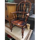 A child's reproduction Windsor armchair.