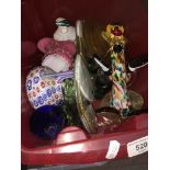 A crate of art glass including clown