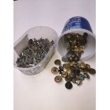 A tub of cufflinks and a tub of military buttons