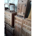 A 1930s limed oak bedroom suite comprising chest of drawers, tallboy, bedside cabinet, dressing