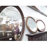 Two oval mirrors and a circular gilt framed mirror