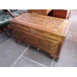 An eastern carve camphor wood chest.