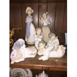 Thre LLadro figures and three Nao figures