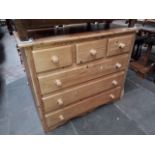 A pine chest of drawers.