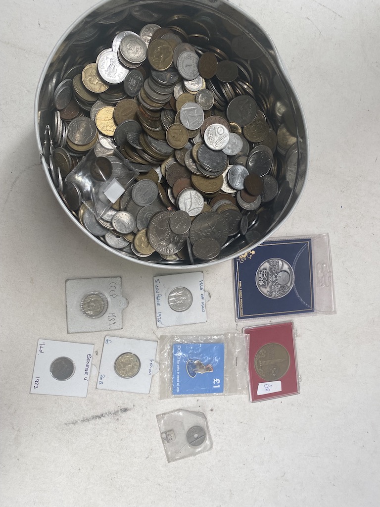 A tin of world coins