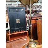 A small oriental style cabinet and a brass standard lamp