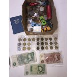 A box of world coins and banknotes etc