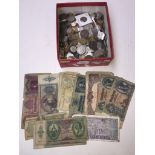A box of world coins and banknotes