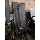 A Yamaha electric bass guitar and hard case.