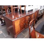 A 1920s mahogany sideboard together with an occasional table and a woven seated chair.
