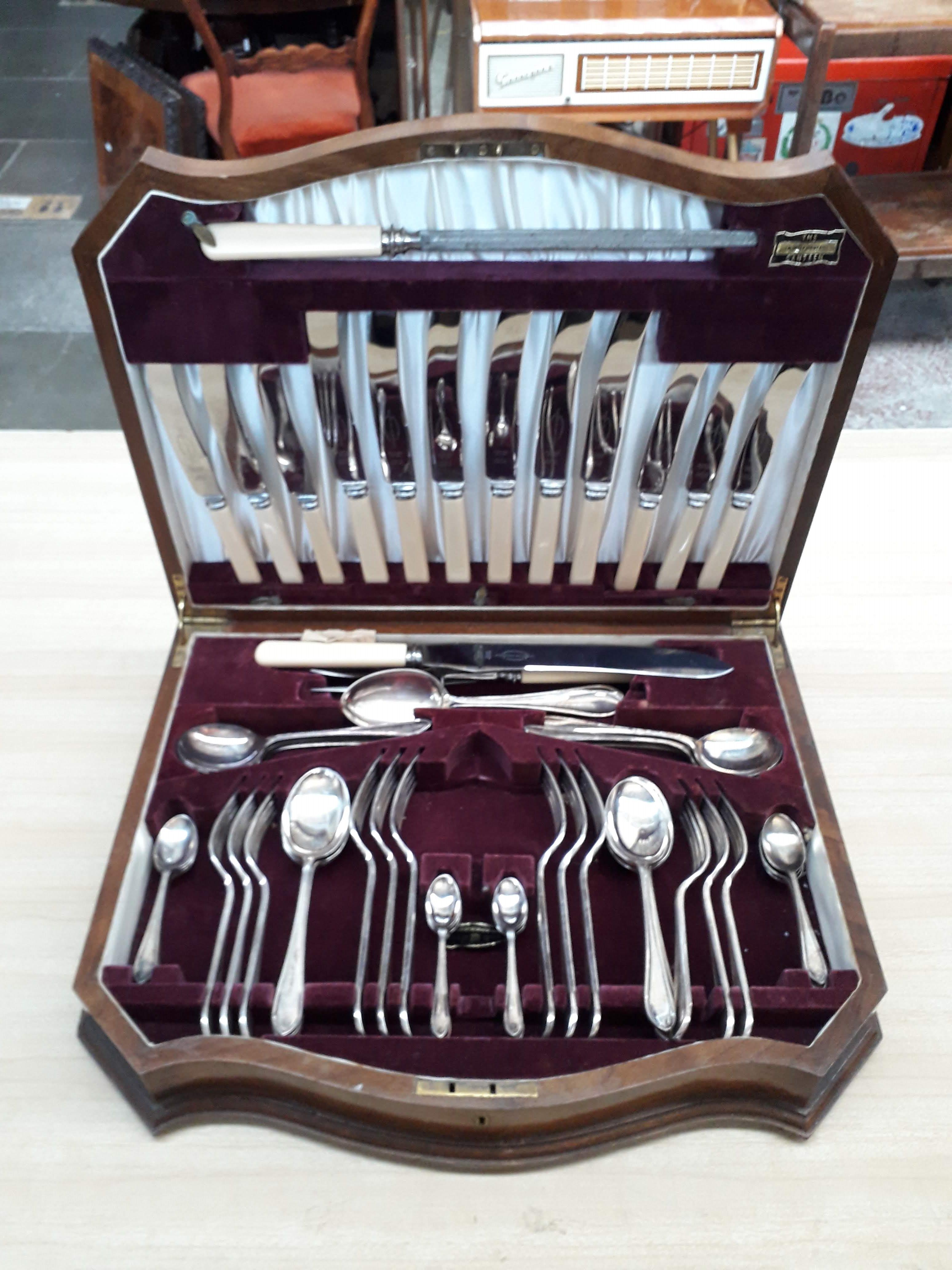 A walnut canteen of Viners silver plated cutlery.