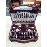 A walnut canteen of Viners silver plated cutlery.