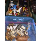 Two boxes of various die cast and plastic model vehicles and model ships.