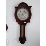 An Edwardian inlaid mahogany barometer.