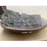 A salt glazed dish and a quantity of leaded glass panels.