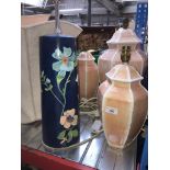 3 matching pottery lamps, a blue painted with flowers vase type lamp and 4 shades in various sizes.