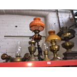 A group of seven oil lamps and a matched pair of carriage lamps.