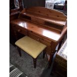 A Ducal pine dressing table and stool.