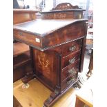 A circa 1900 Davenport inlaid desk on castors, having 4 drawers on one side and 4 false drawers on