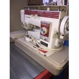 A New Home electric sewing machine.