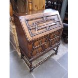 An oak bureau with barley leg detail