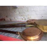 3 brass and copper warming pans and a copper & brass hunting horn