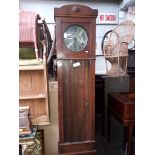 An oak longcase clock