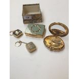 A box containing musical keyrings and compacts (Stratton & Kigu)