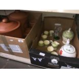 A box containing 2 large terracotta storage jars with lids, 2 smaller ones, and another box to