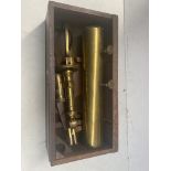 An antique brass telescope in wooden case.