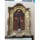 A 19th century ornate gilded gesso frame approx 40 x 59cm - has previously held a crucifix but not