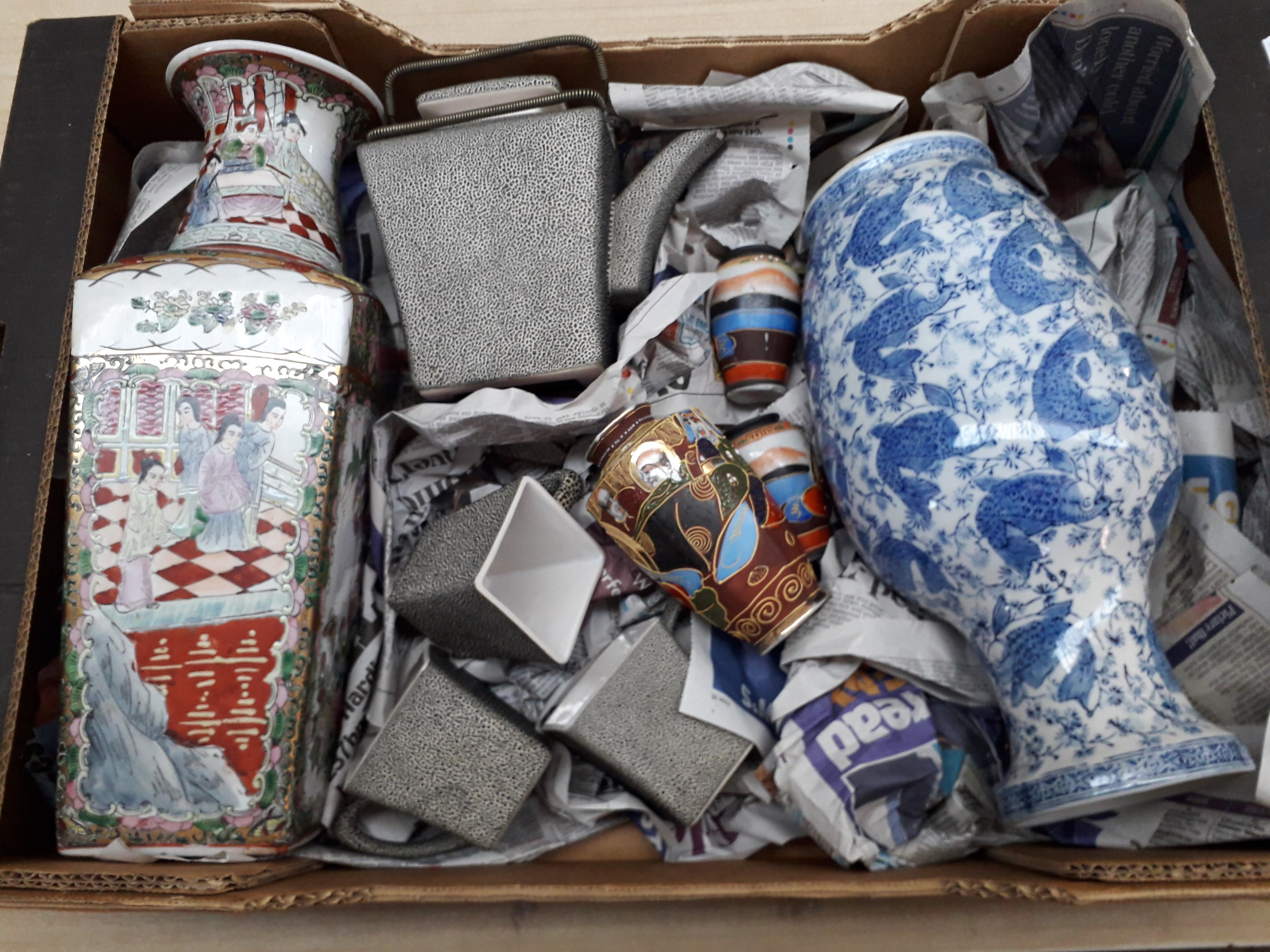 A box of Oriental porcelain and a box of pottery ornaments.