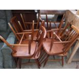 A set of eight retro spindle back chairs.