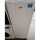 A Beko tall freezer.