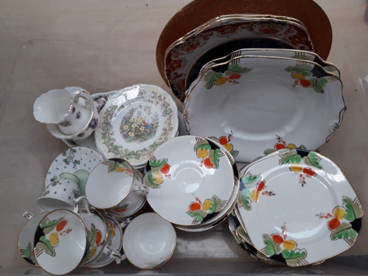 A box of china including an Diamond Art Deco style part tea set, Royal Albert, Royal Doulton etc.