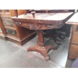 A Victorian rosewood fold top games table, width 92cm, depth 45.5cm and height 69.5cm.