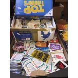 A box Brooke Bond TeaTyphoo and tea cards, a box of collectable trading cards and a Top Trumps game