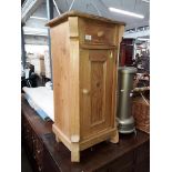 A continental pine bedside cabinet.