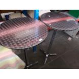 A pair of stainless steel effect bar tables.