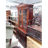 An Edwardian mahogany cabinet bookcase.