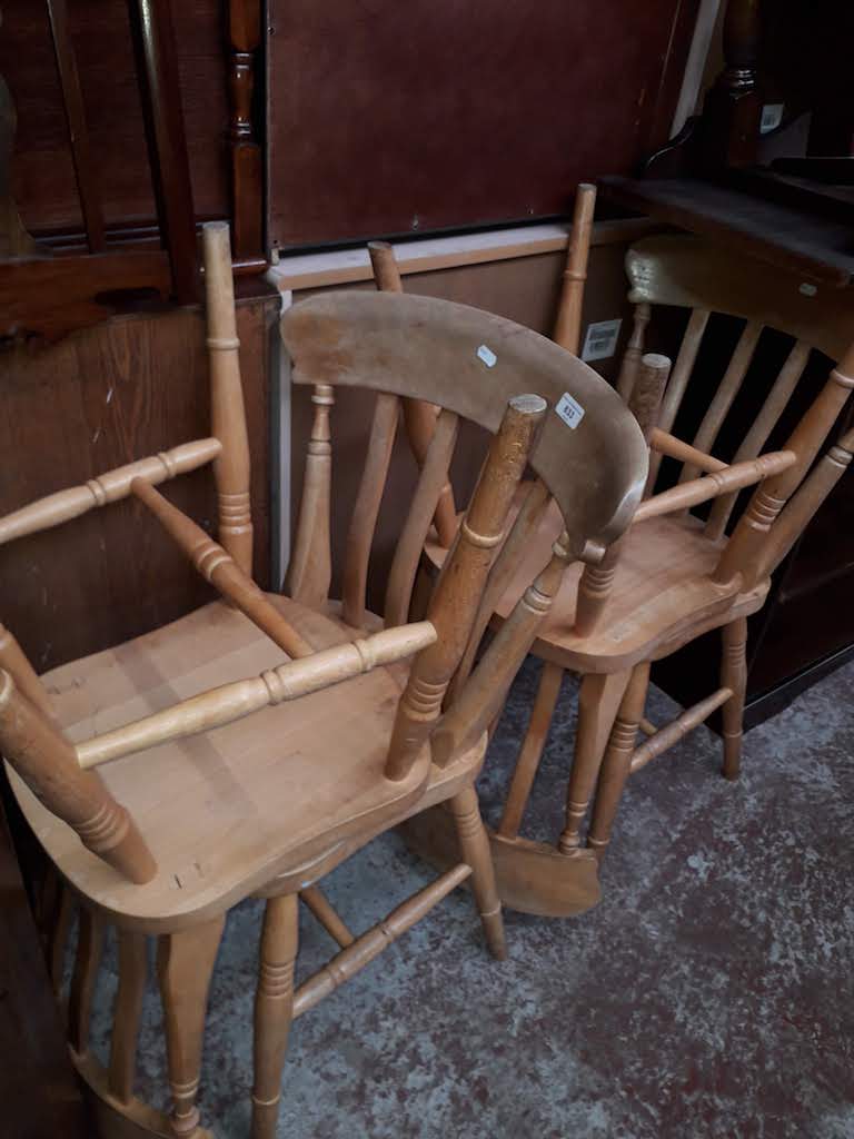 A set of four light beech chairs.