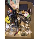 Box containing various items of costume jewellery, watches, rifle sight glassware etc